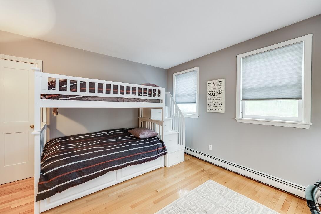 227 Run Hill Road Brewster, MA 02631 - Photo 52 of 89 a living room with a piano and a window