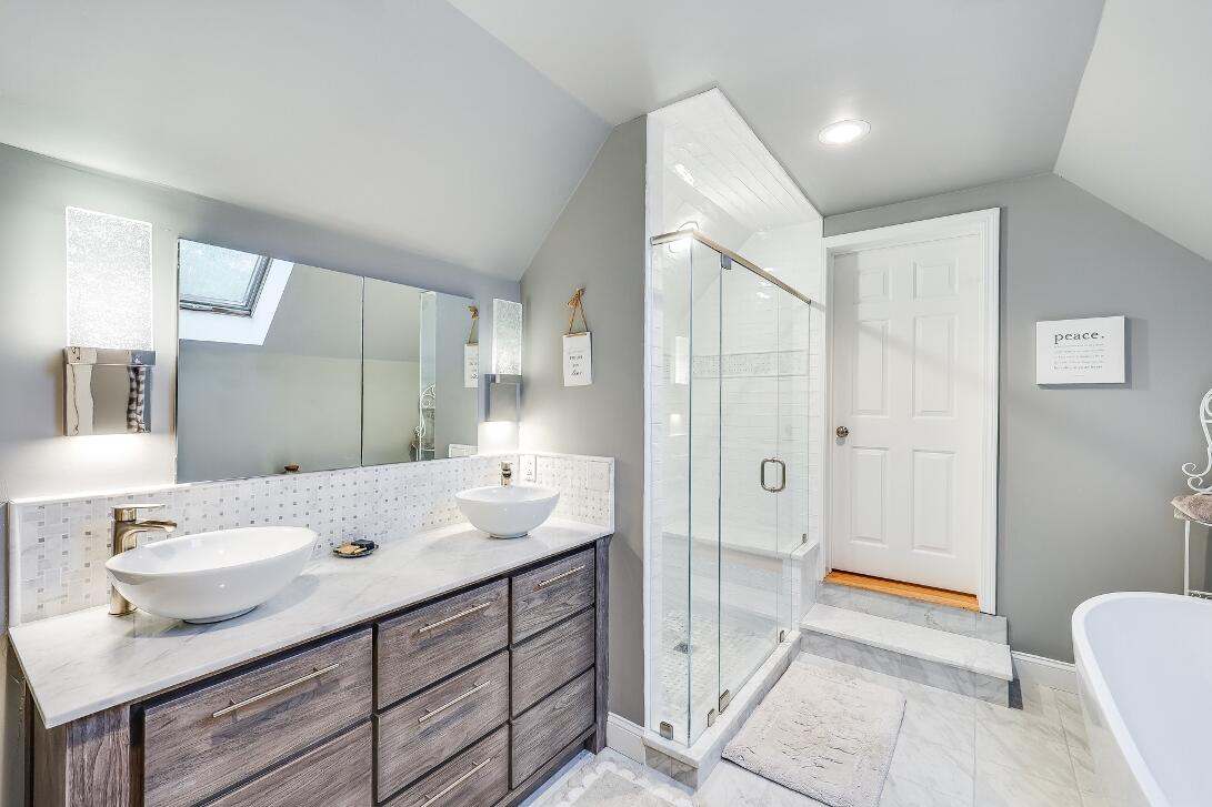 227 Run Hill Road Brewster, MA 02631 - Photo 54 of 89 a en suite bathroom with a double vanity sink a mirror and a shower