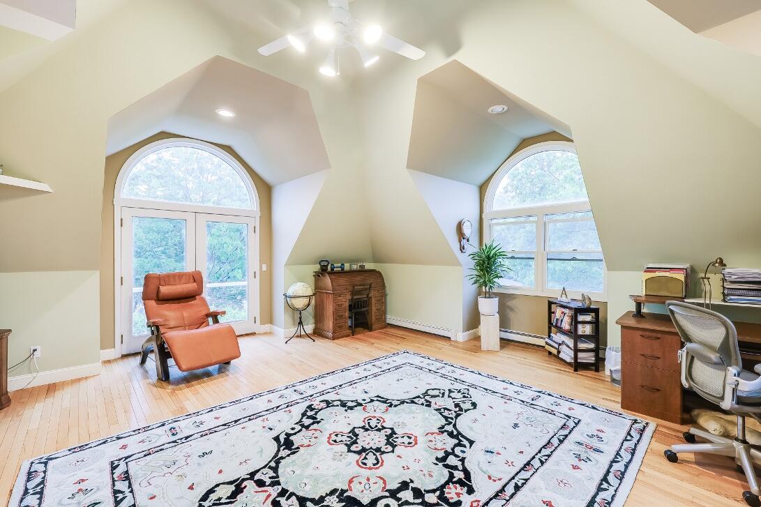 227 Run Hill Road Brewster, MA 02631 - Photo 62 of 89 a bedroom with furniture and a wooden floor