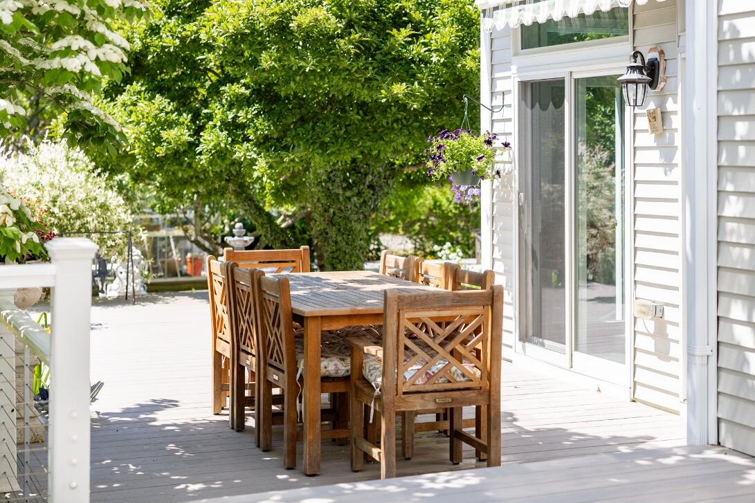 227 Run Hill Road Brewster, MA 02631 - Photo 68 of 89 a patio with table and chairs and potted plants