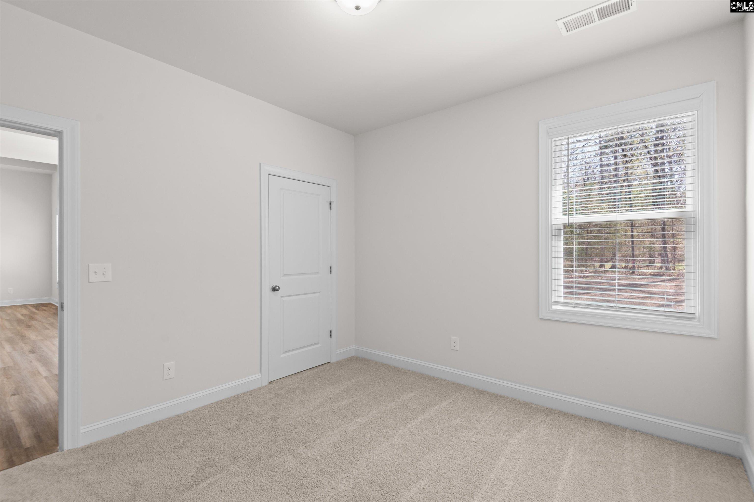 558 Wild Ginger Loop Irmo, SC 29063 - Photo 28 of 42 a view of an empty room with a window