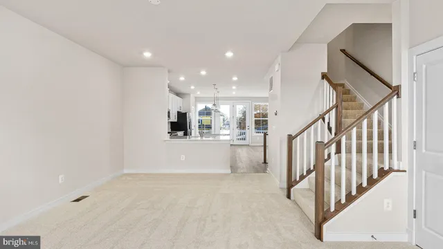 a view of an empty room with stairs