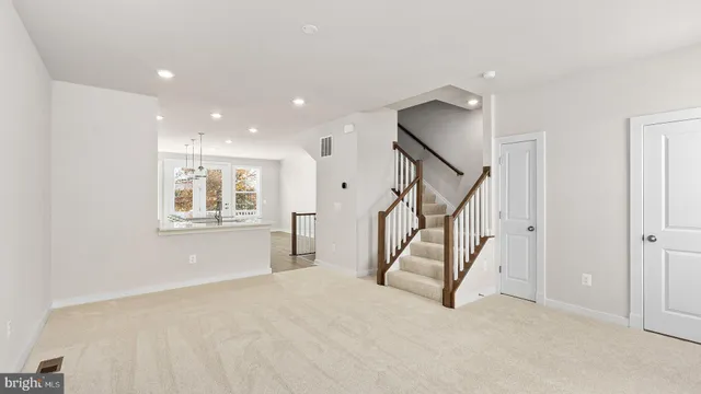 a view of an empty room with stairs