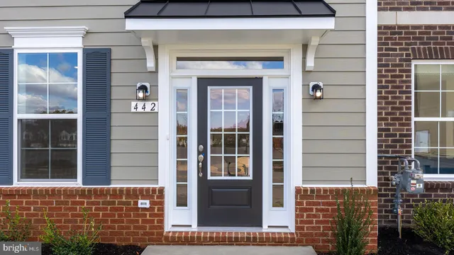 a view of front door of a house with a window