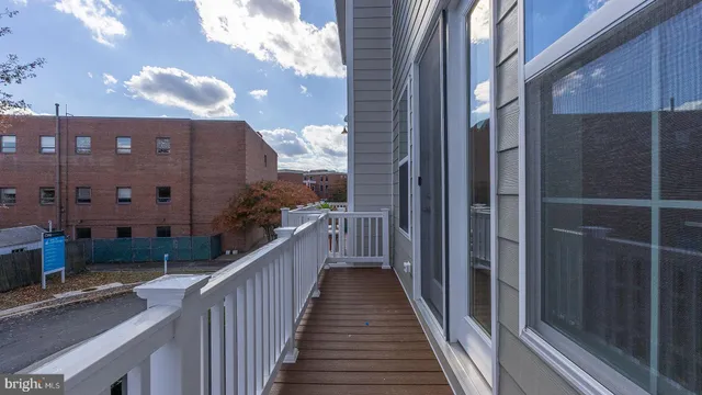 a view of a balcony with wooden floor