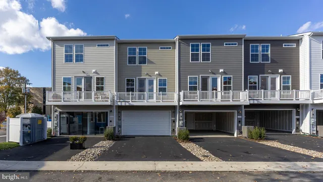 a front view of a building with many windows