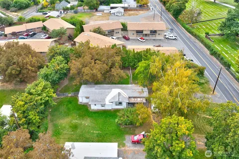 a view of yard with swimming pool and trees