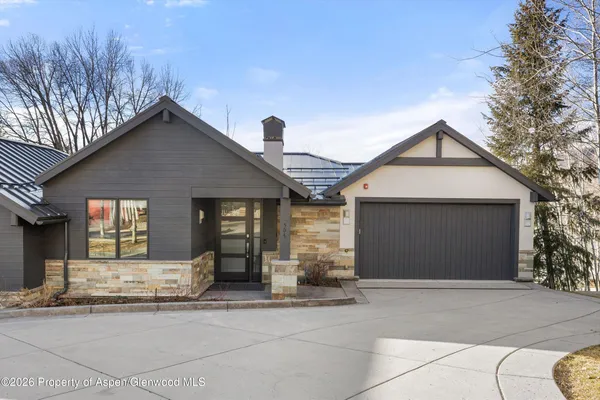a front view of a house with a garage