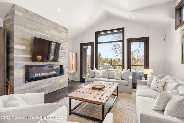 a living room with furniture and a flat screen tv
