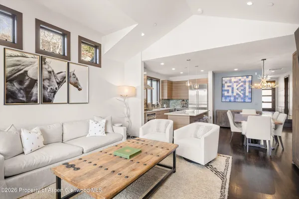 a living room with furniture and a table