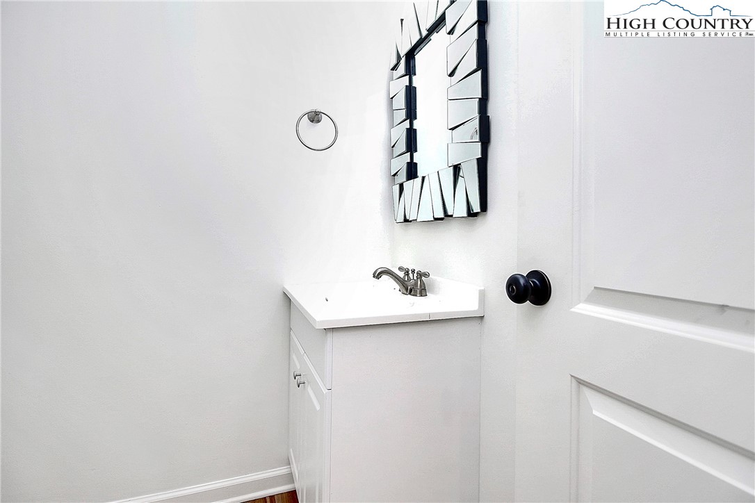 3520 Colony Road, Unit I Charlotte, NC 28211 - Photo 4 of 30 a bathroom with a sink and mirror