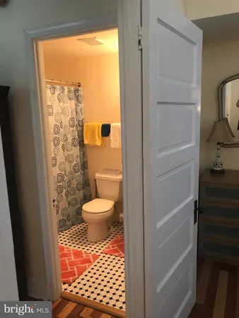 a bathroom with a glass shower door