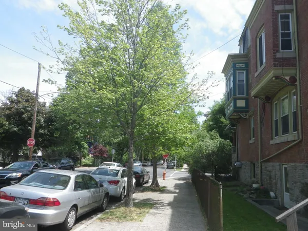a view of a house that has a lot of flowers