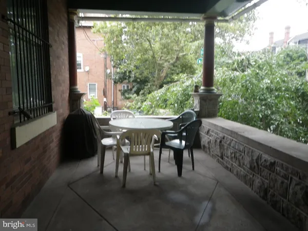 a balcony view with a backyard
