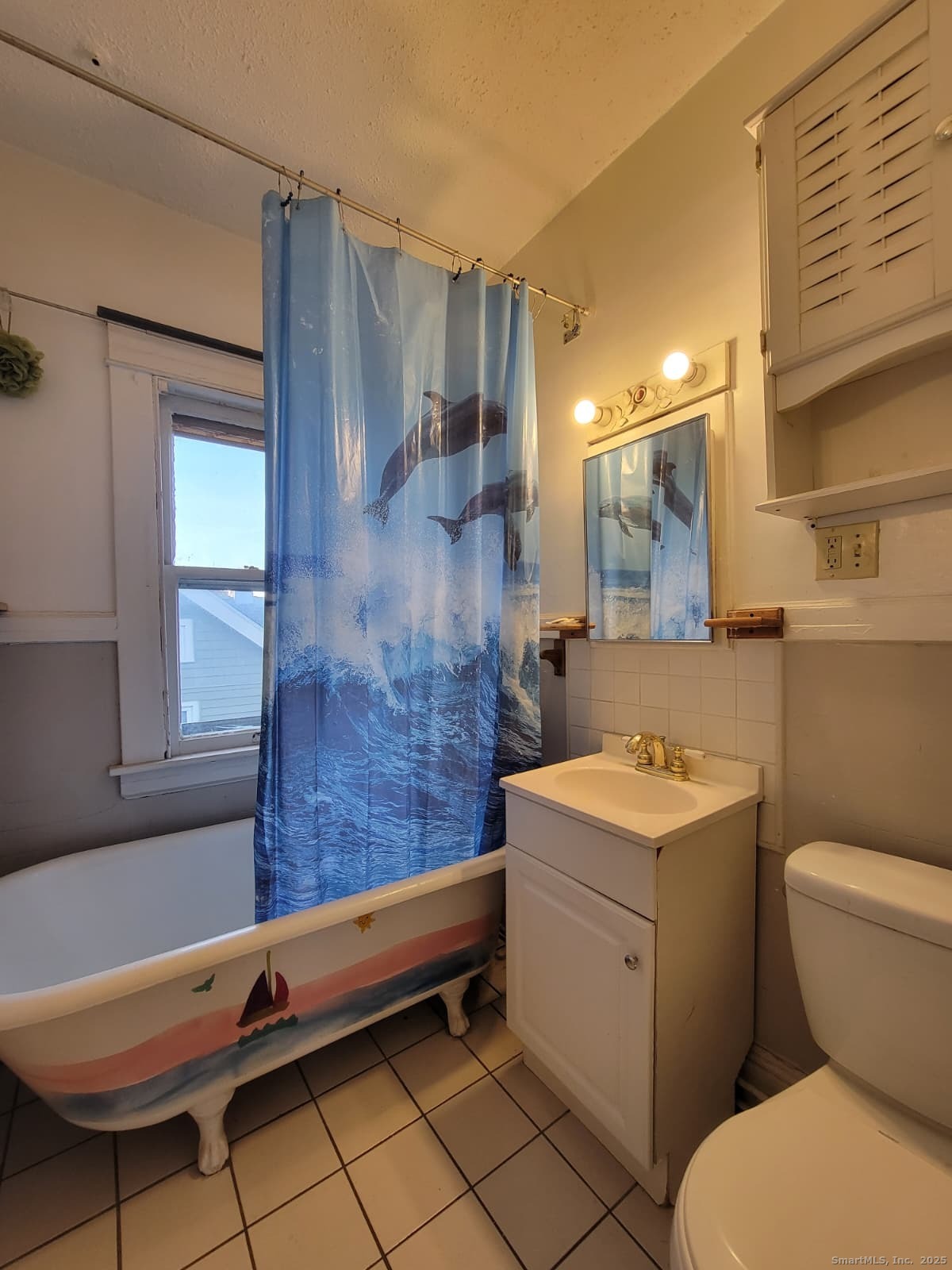 45 Belden Street New Britain, CT 06051 - Photo 11 of 11 a bathroom with a sink a toilet a mirror and shower