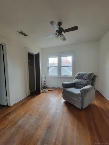 a living room with couches and a window
