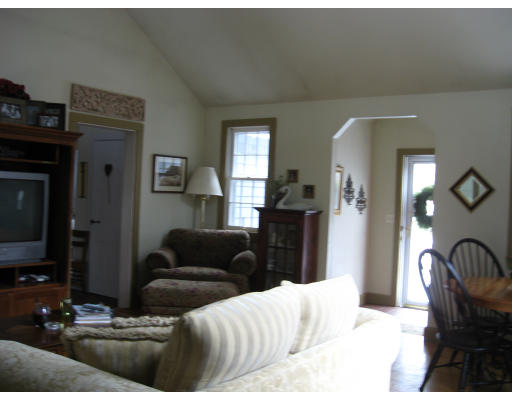 62 Streeter Road Sturbridge, MA 01518 - Photo 8 of 22 a living room with furniture and a fireplace