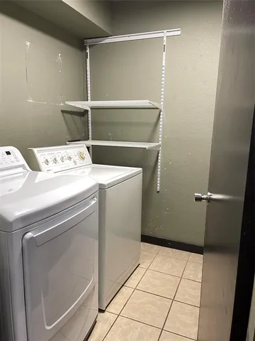 a utility room with washer and dryer