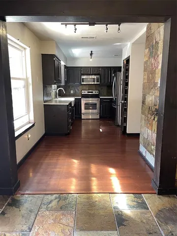 a view of kitchen with furniture and window