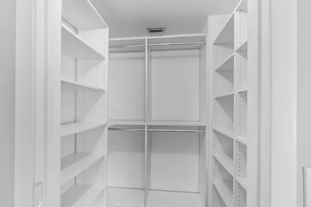 a view of an empty walk in closet