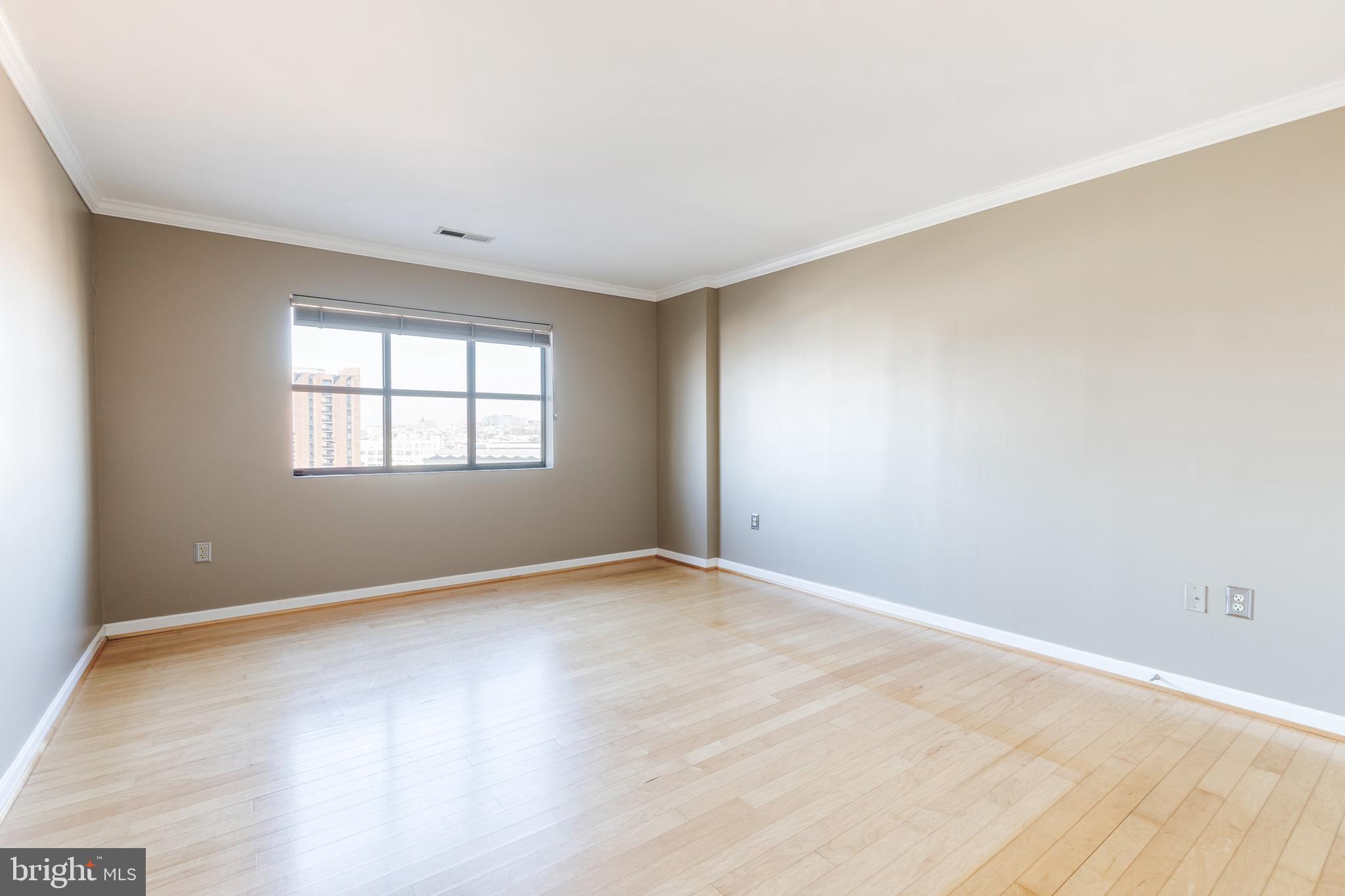 2702 Lighthouse Point East, Unit 712 Baltimore, MD 21224 - Photo 15 of 21 an empty room with a window