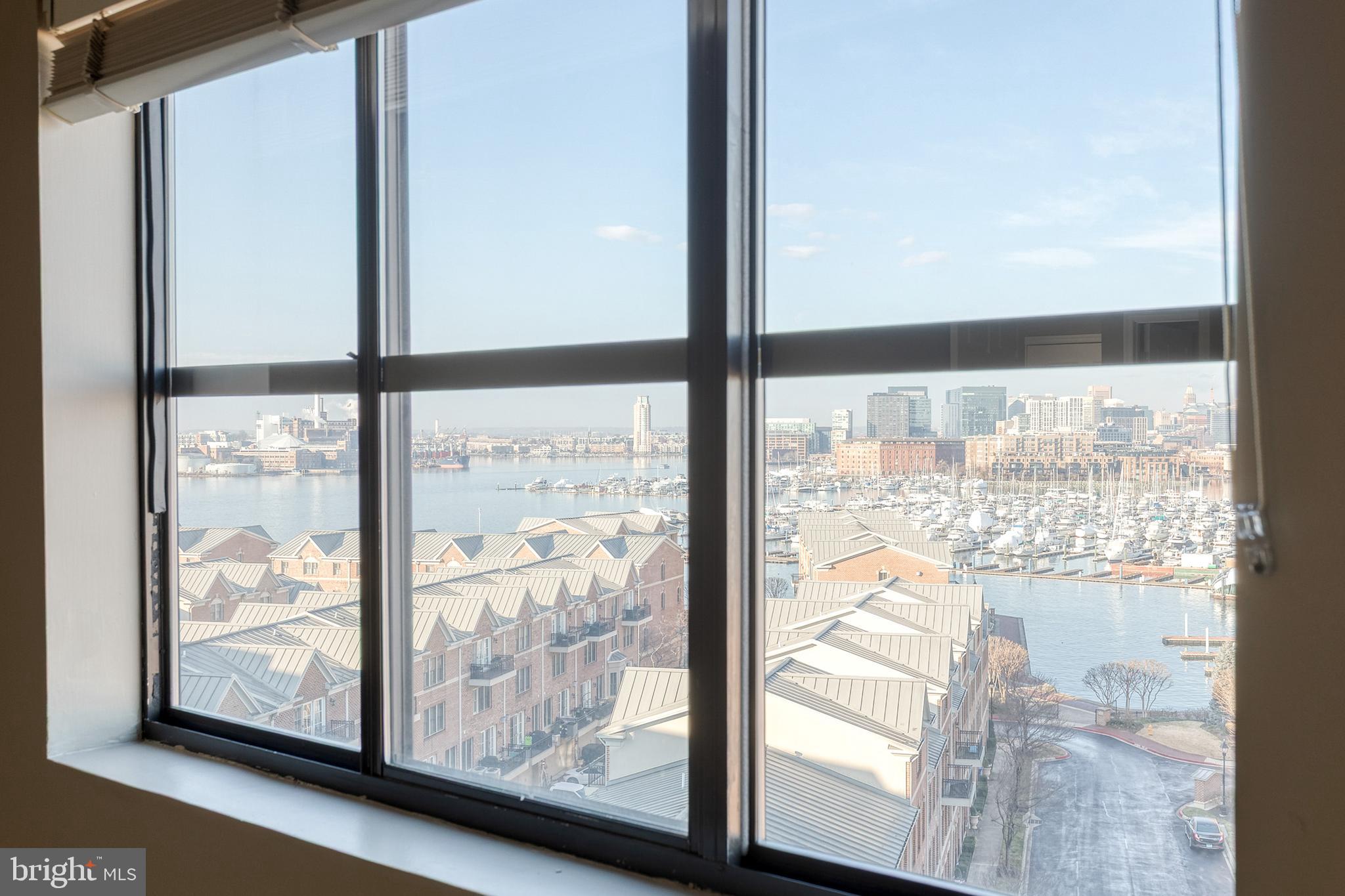 2702 Lighthouse Point East, Unit 712 Baltimore, MD 21224 - Photo 16 of 21 a view of a glass door with a from a window