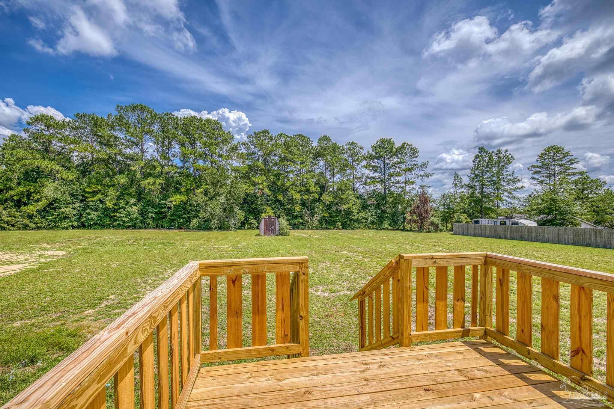 4644 Farm Life Road Milton, FL 32583 - Photo 39 of 39 a view of a balcony with lake view