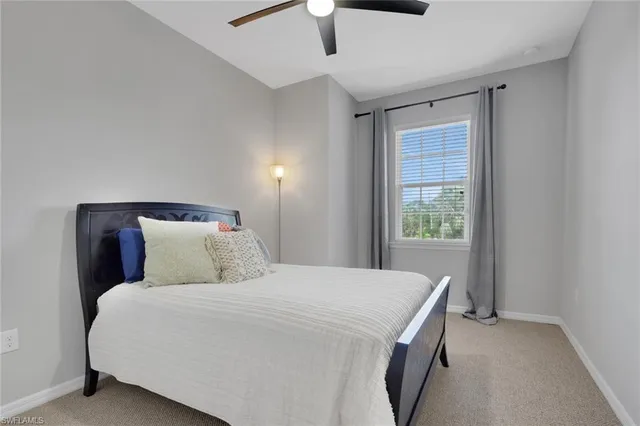 a bed room with a bed and a chandelier