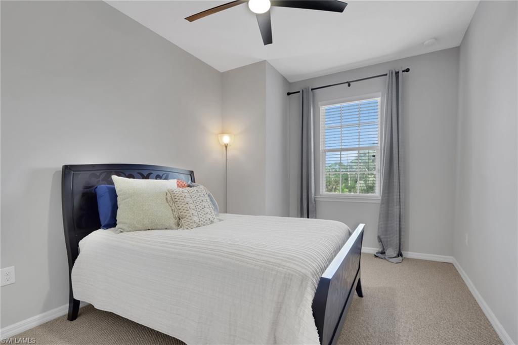 18320 Creekside Preserve Loop, Unit 201 Fort Myers, FL 33908 - Photo 18 of 27 Bedroom with a ceiling fan and light carpet