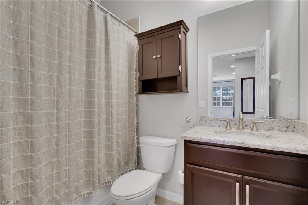 18320 Creekside Preserve Loop, Unit 201 Fort Myers, FL 33908 - Photo 20 of 27 Full bath with vanity and shower / bath combination with curtain