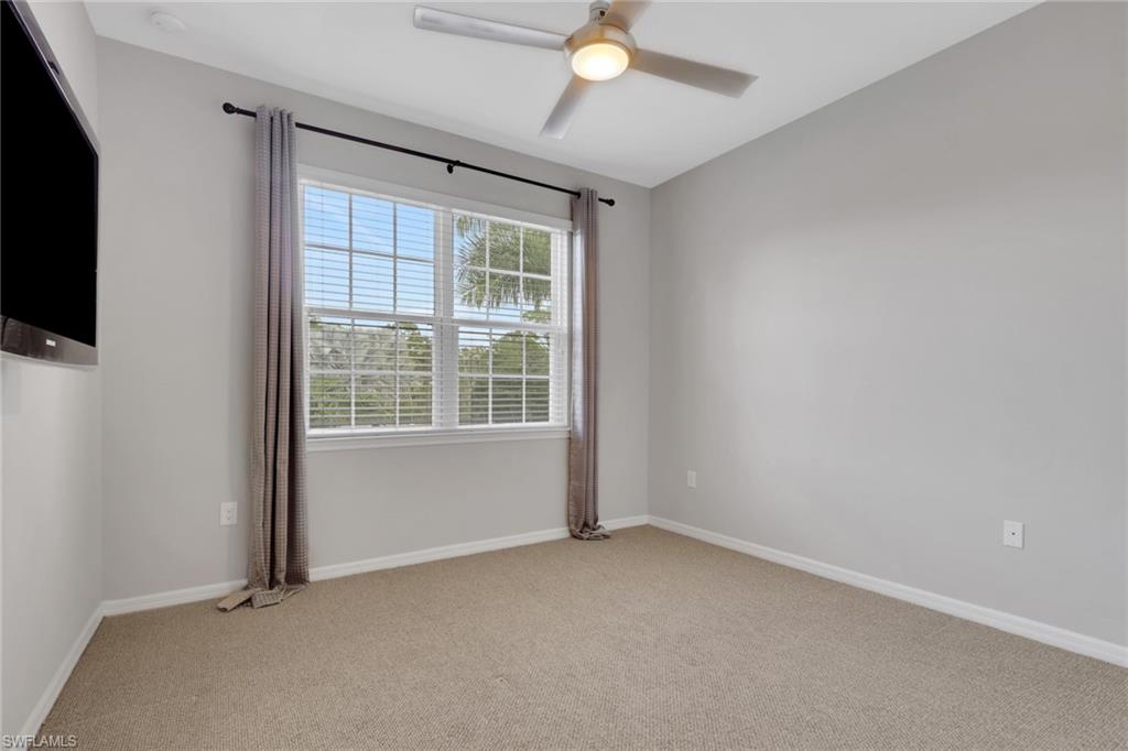 18320 Creekside Preserve Loop, Unit 201 Fort Myers, FL 33908 - Photo 21 of 27 Unfurnished room featuring light carpet and ceiling fan