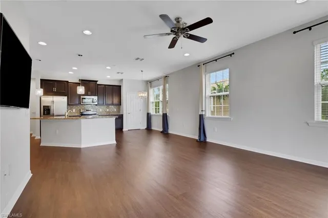 a view of kitchen with cabinets and wooden floor