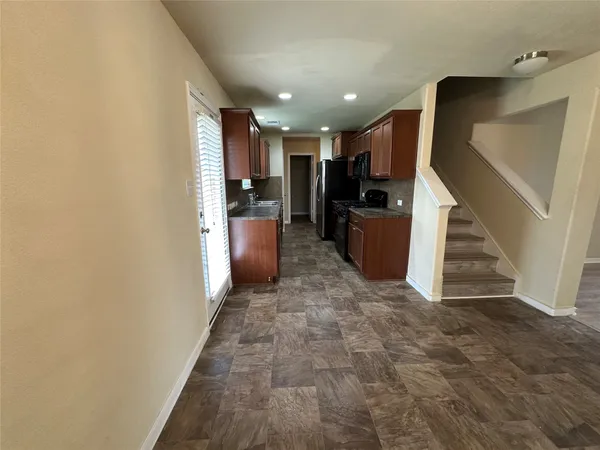 a view of entryway and kitchen