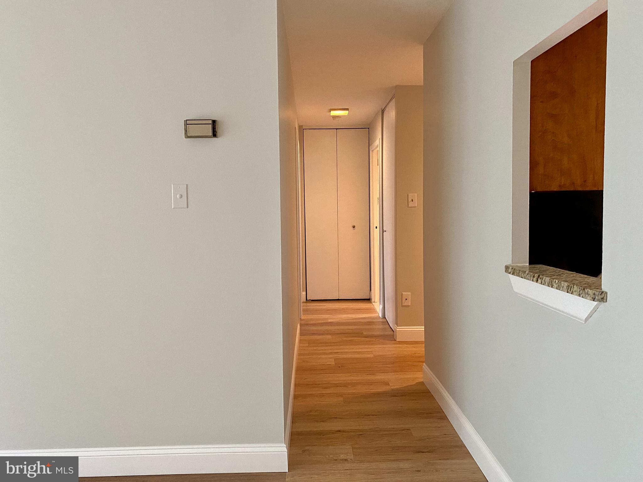 100 West Avenue, Unit 218S Jenkintown, PA 19046 - Photo 16 of 29 a view of a hallway with wooden floor