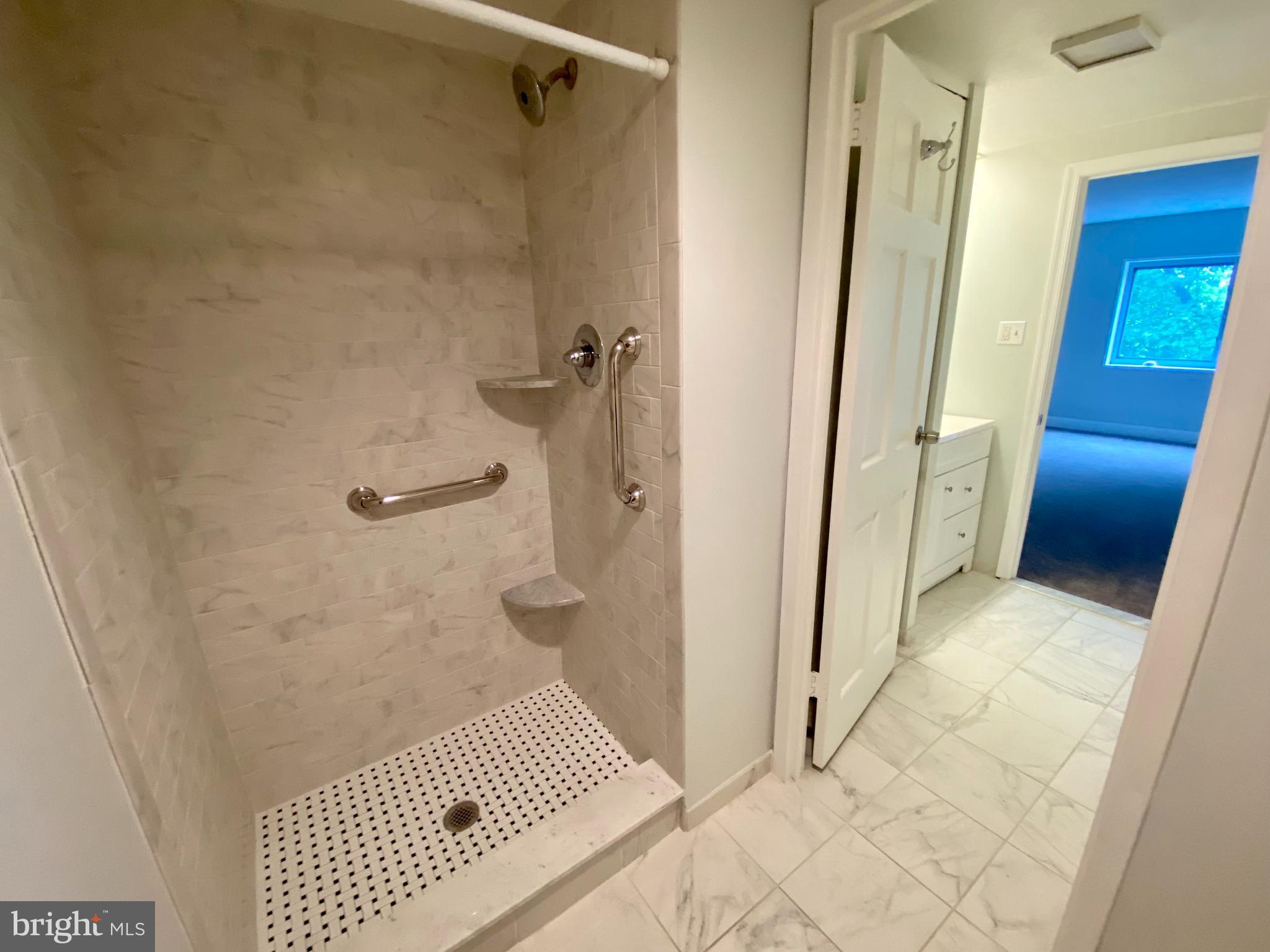 100 West Avenue, Unit 218S Jenkintown, PA 19046 - Photo 18 of 29 a bathroom with a glass door shower