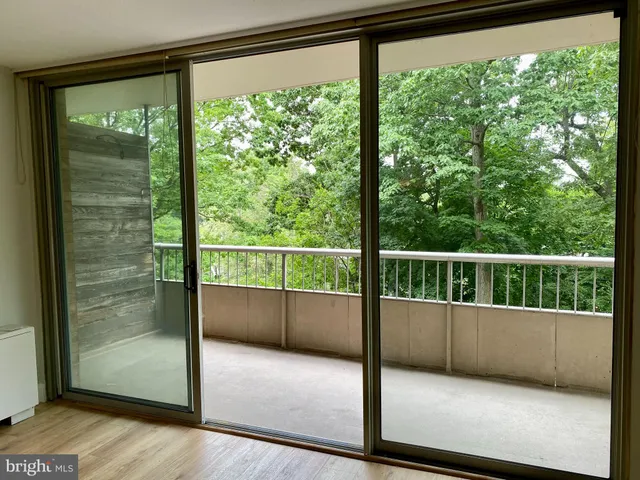 a view of a glass door with a balcony