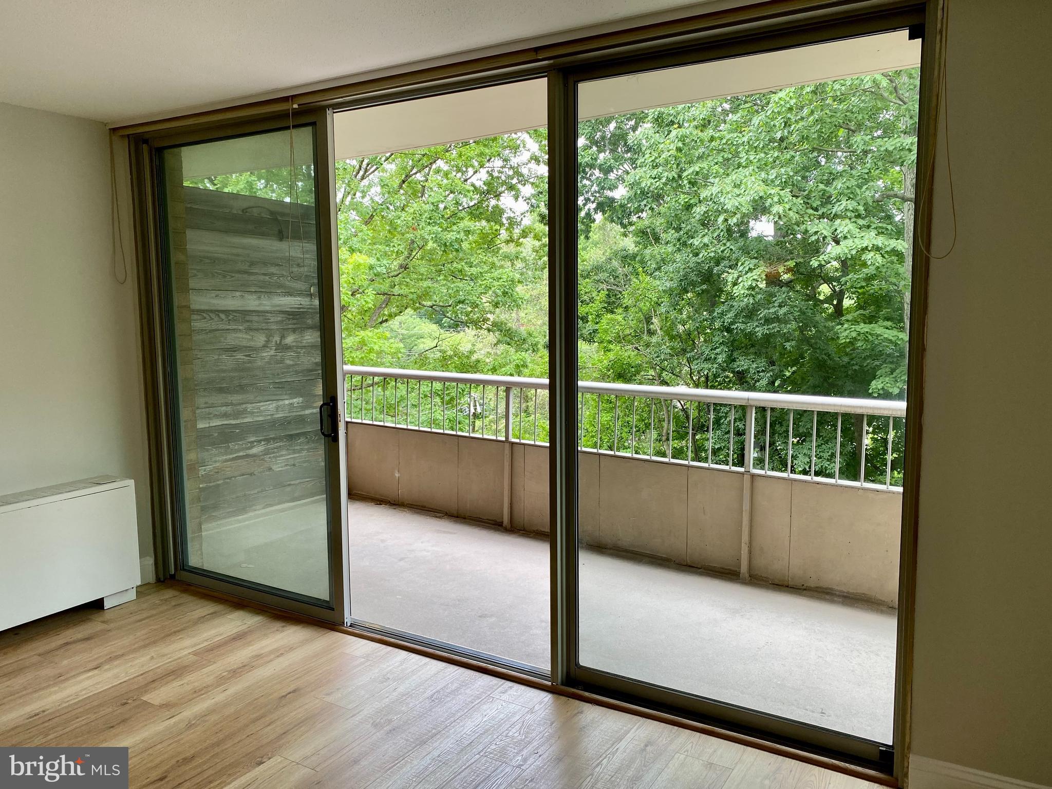 100 West Avenue, Unit 218S Jenkintown, PA 19046 - Photo 6 of 29 a view of a glass door with wooden floor