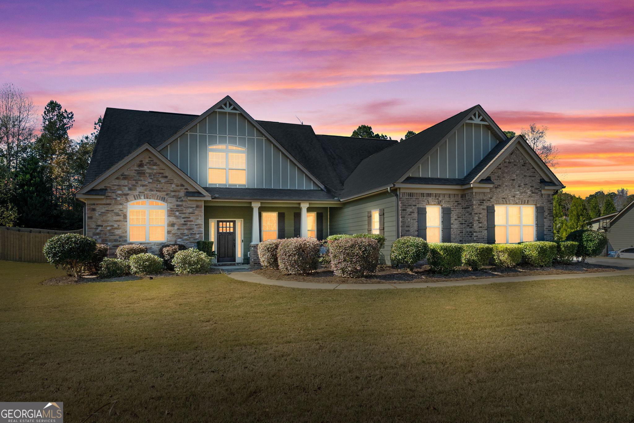 165 Caraway Road Locust Grove, GA 30248 - Photo 1 of 1 a front view of a house with a yard