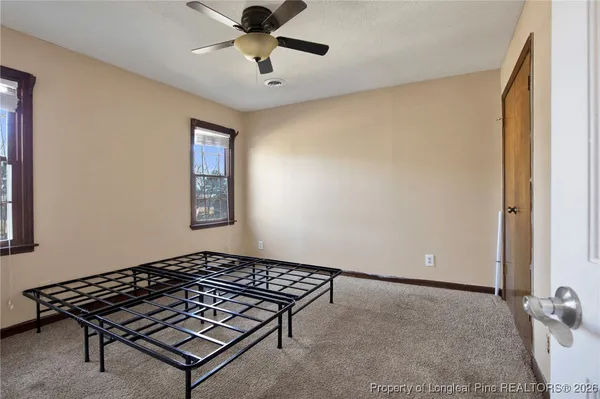 a bedroom with a bed and a shower