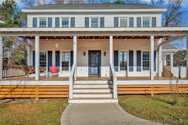 front view of a house with a swimming pool