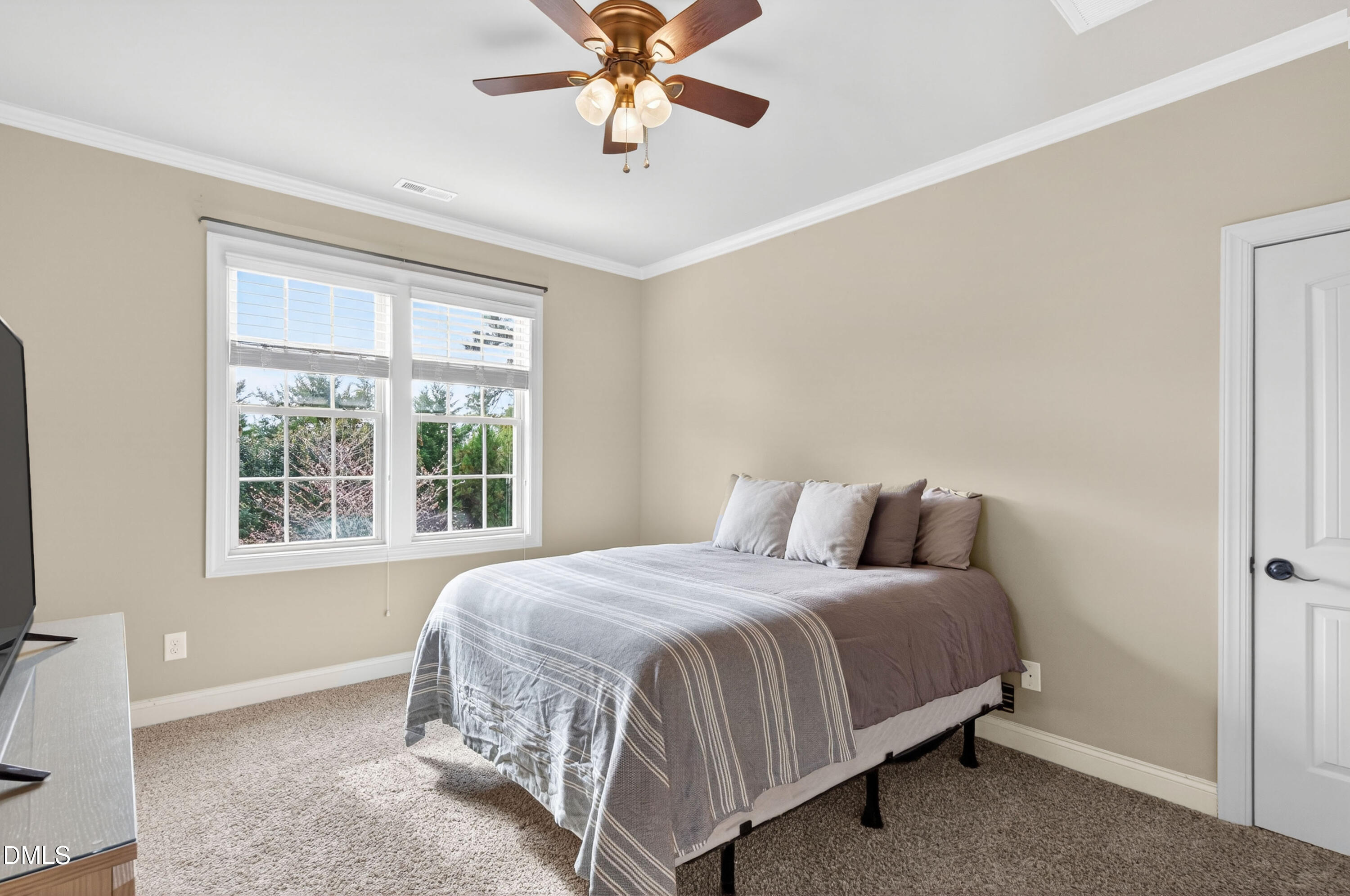 691 Hawthorne Place Creedmoor, NC 27522 - Photo 54 of 84 a bedroom with a bed and window