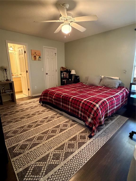 2861 Surf Drive Deltona, FL 32738 - Photo 12 of 20 a bedroom with a bed and wooden floor