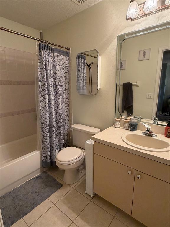 2861 Surf Drive Deltona, FL 32738 - Photo 14 of 20 a bathroom with a toilet sink and shower