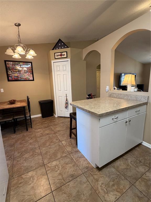 2861 Surf Drive Deltona, FL 32738 - Photo 15 of 20 a view of living room with granite countertop furniture and a window