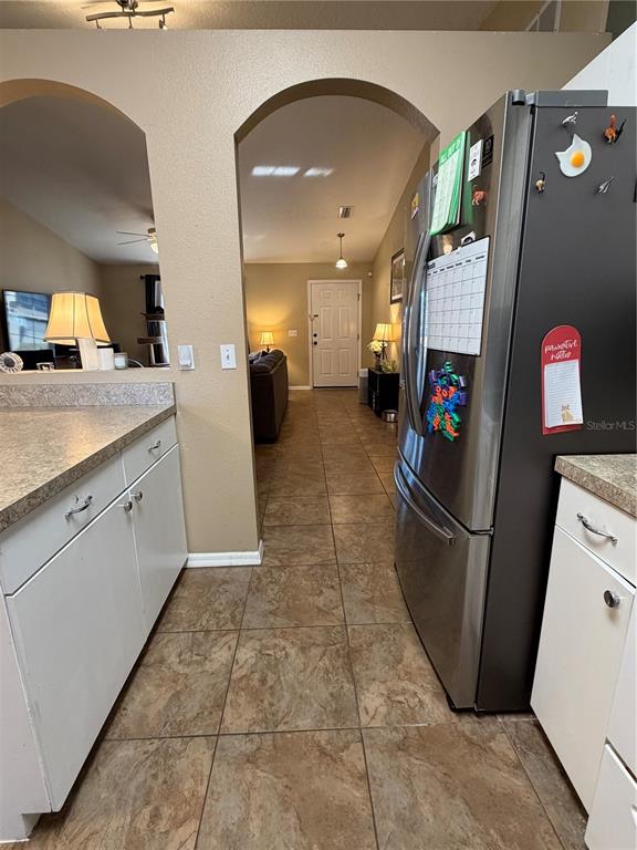 2861 Surf Drive Deltona, FL 32738 - Photo 16 of 20 a kitchen with stainless steel appliances granite countertop a refrigerator and a sink