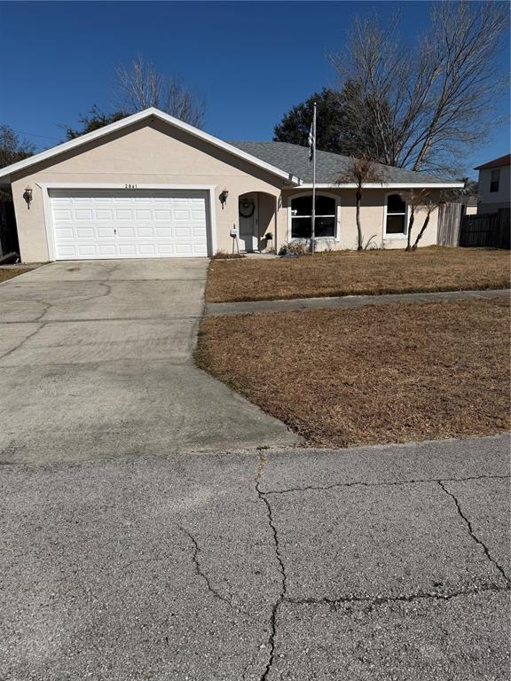 2861 Surf Drive Deltona, FL 32738 - Photo 2 of 20 a front view of a house with garage
