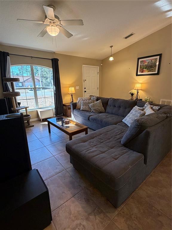 2861 Surf Drive Deltona, FL 32738 - Photo 4 of 20 a living room with furniture and a large window