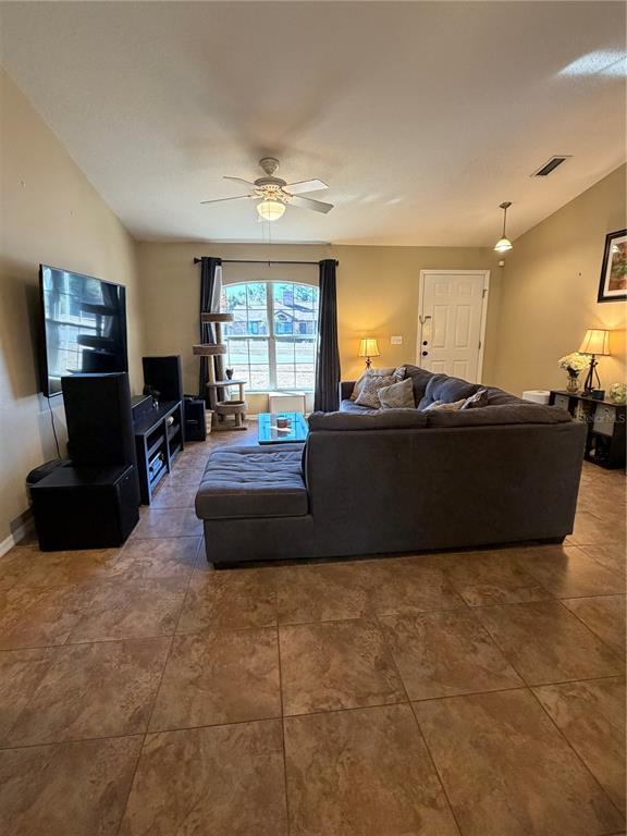 2861 Surf Drive Deltona, FL 32738 - Photo 5 of 20 a living room with furniture window and a flat screen tv