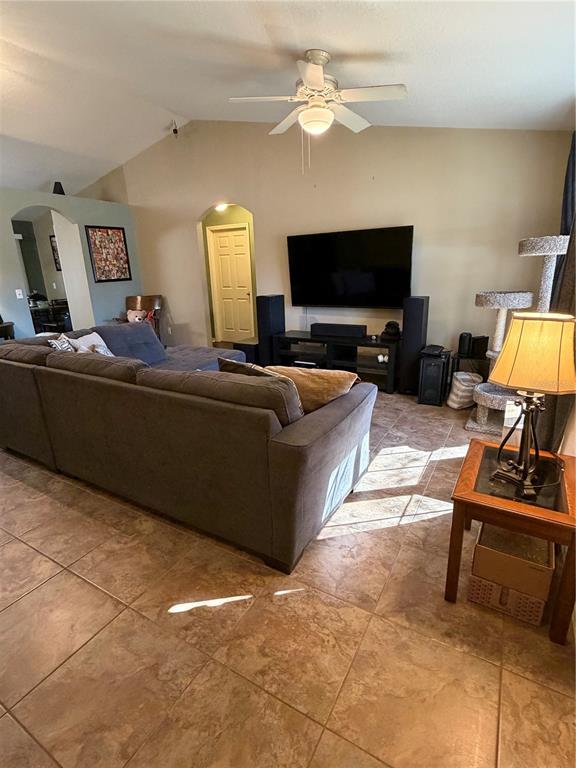 2861 Surf Drive Deltona, FL 32738 - Photo 6 of 20 a living room with furniture and a flat screen tv