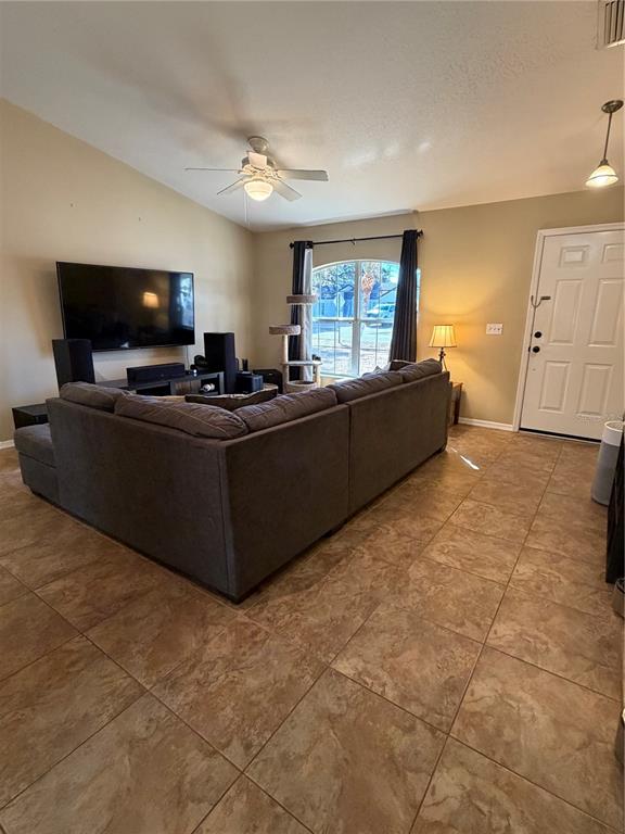 2861 Surf Drive Deltona, FL 32738 - Photo 8 of 20 a living room with furniture and a flat screen tv